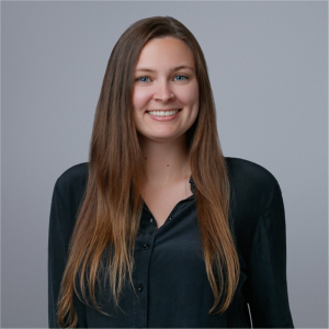 portrait image of Ashley Arnell against a plain light gray background
