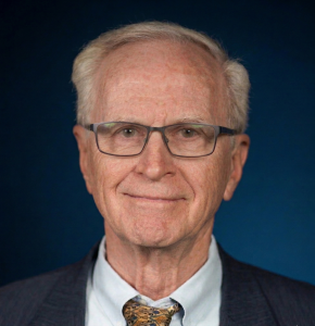 portrait of kent lloyd with dark blue background