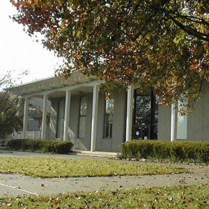 Outside of the National Biomedical Research Institute with trree in foreground