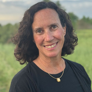 portrait image of sheryl soucy-lubell with green landscape in background